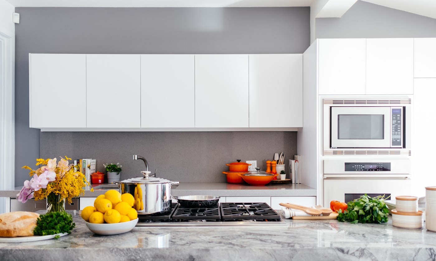 A bright kitchen with built-in oven and microwave